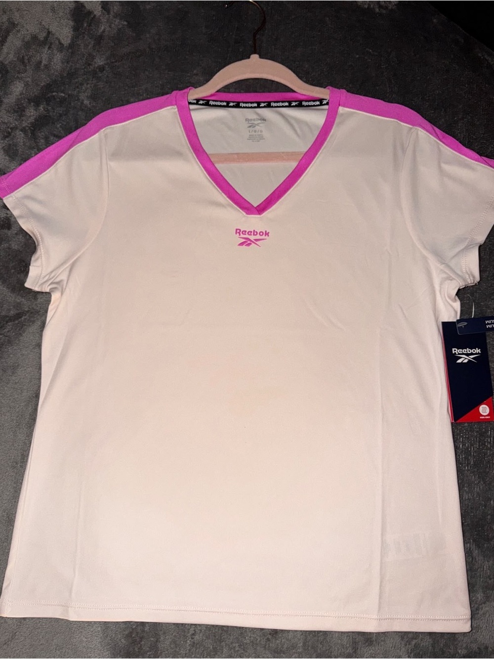 Reebok Women's White V-Neck Tee with Pink Trim Accents